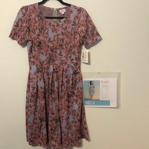 Amelia Fabric of poly and span blend Zipper back